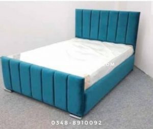 teal cushioned queen bed