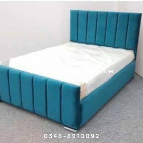 teal cushioned queen bed