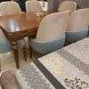 Contemporary dining table with six fabric chairs and wooden dining table design