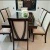 Wooden dining table with fabric dining chairs and Sheesham wood construction