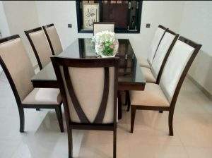 Wooden dining table with fabric dining chairs and Sheesham wood construction