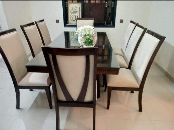 Wooden dining table with fabric dining chairs and Sheesham wood construction