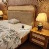 Luxury cane king size bed with upholstered headboard in Pakistan.