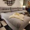 Oversized L-shaped Cloud sectional sofa styled for a contemporary living room.