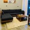 Lugano minimal sectional sofa in Pakistan with charcoal upholstery and wooden frame