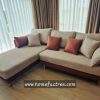 Minimal sectional sofa with charcoal cushions and wooden frame